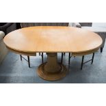 EXTENDING DINING TABLE, with internal leaf, oval on heavily carved central stand,