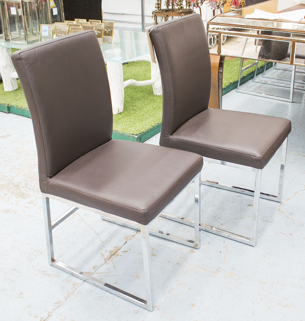 CONTEMPORARY DINING CHAIRS, a set of six, in dark brown faux leather on chromed metal supports,