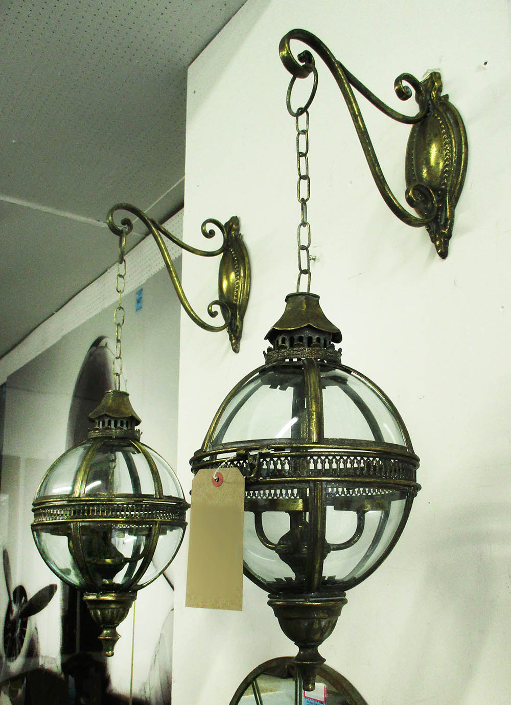 HANGING LANTERNS, a pair, globe type on wall brackets, 80cm H.