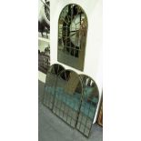 ARCHITECTURAL MIRRORS, a set of four, domed top in a metal frame, 77cm x 49cm.