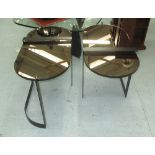 MIRRORED LOW TABLES, a pair, on black metal supports, 82cm x 40cm x 51cm H.