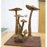 WOODEN MUSHROOMS, a set of three, various sizes natural wood polished finish, tallest 81cm,