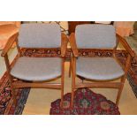 ARMCHAIRS, a pair, of 1970's vintage teak with upholstered backs and seats.