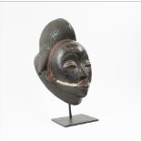 BAULE FACE MASK, West African carved wood, approx., 34cm H x 22cm W with metal display stand.