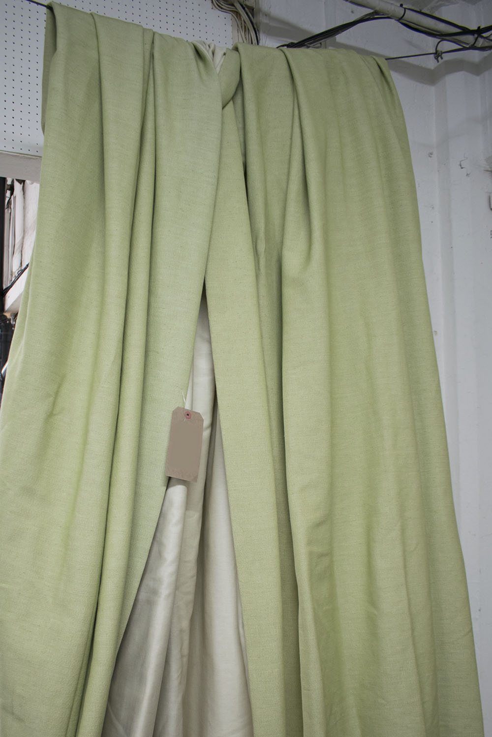 CURTAINS, a pair, in lime green, lined, 140cm W (gathered) x 240cm L.