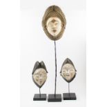 TRIBAL ARTS, three decorative Pune face masks, carved and painted wood, largest 42cm H x 26cm W,