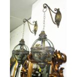 LANTERNS, a pair, spherical, wall mounted with brackets, 74cm H.