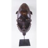 FANG HEAD MASK, West African, carved wood, 46cm H x 22cm W max, plus a display stand.