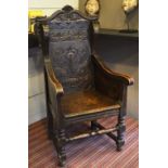 ARMCHAIR, late 19th century Jacobean style oak with foliate urn and serpent carved back, 64cm W.