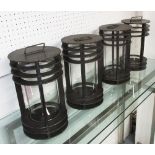 STORM LANTERNS, a set of four, circular in black metal finish, 31cm H.