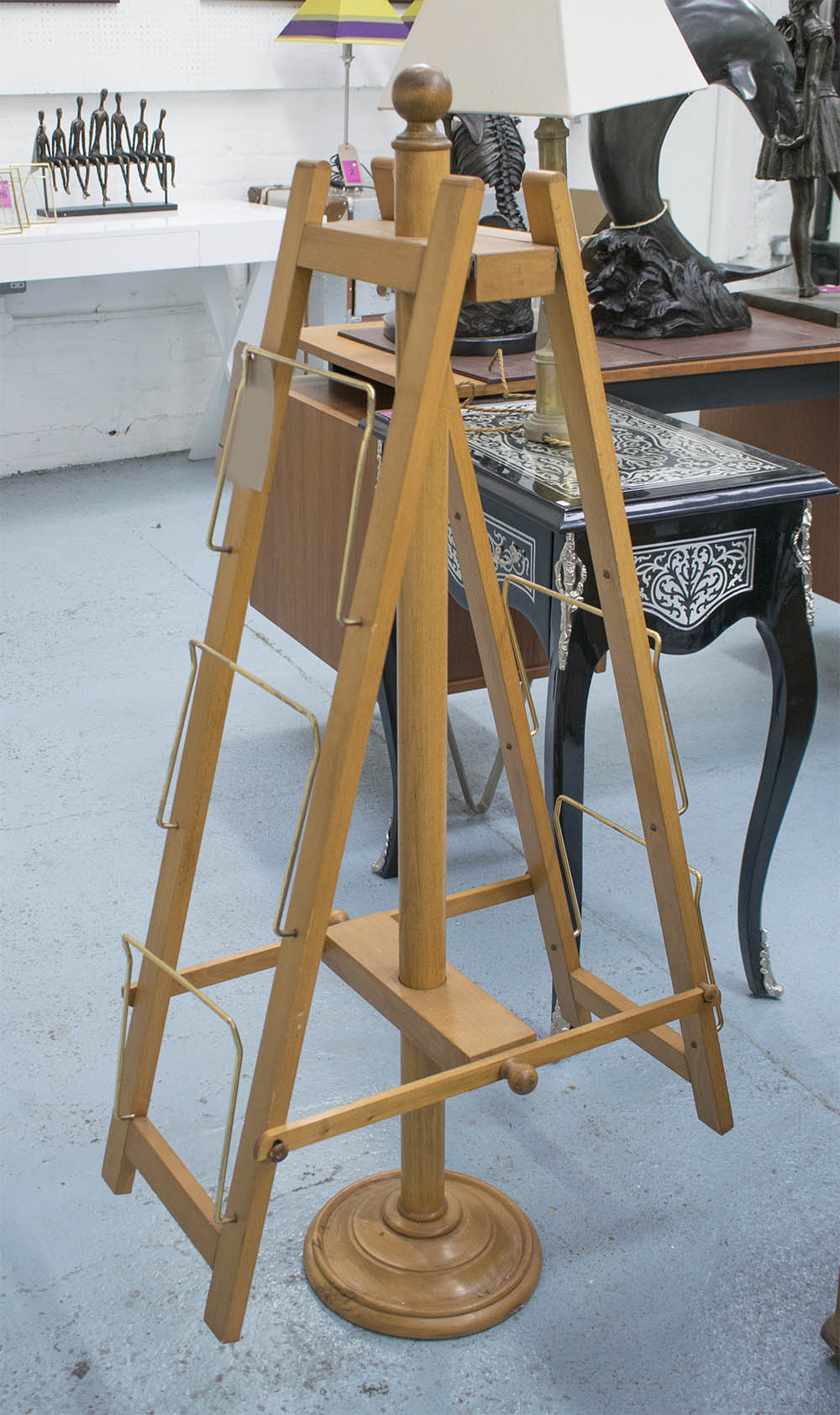 NEWSPAPER RACK, in wood with brass fittings, 124cm H.