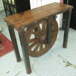 CONSOLE TABLE, in iron and wood on square supports with wheel below, 124cm x 49cm x 99cm H.