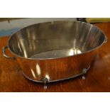 CHAMPAGNE BUCKET, Georgian style oval silvered metal with lion paw supports, 55cm L x 22cm H.