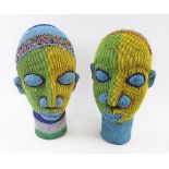 IFE BEADED HEADS, a companion pair, of colourful design, each 37cm H.