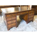 PEDESTAL DESK, early 18th century English style walnut with nine drawers and leather top,