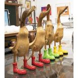 WOODEN RUNNER DUCKS, a set of four, carved solid wood in polished finish, 50cm H.