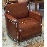 ARMCHAIRS, a pair, upholstered in hand finished leaf brown stitched leather,