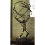 TABLE ORNAMENT, of Atlas holding a sphere on black base, 46cm H.