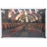 21ST CENTURY PHOTOPRINT, of barrels in wine cellar on tempered glass, 100cm x 150cm.