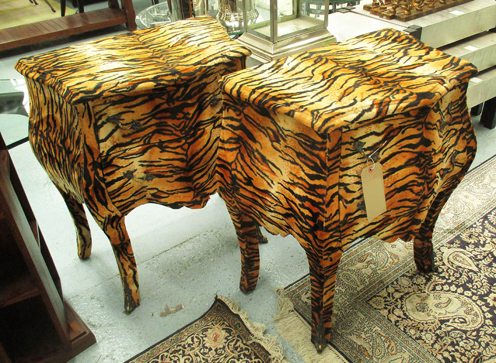 BOMBE BEDSIDE COMMODES, a pair, in tiger print finish, 71cm W x 41cm D x 75cm H.