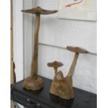 WOODEN MUSHROOMS, two, natural wood, polished finish and free standing, one 45cm H the other 78cm H.