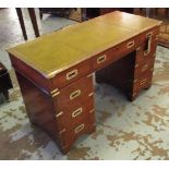DESK, Campaign style mahogany and brass bound with nine drawers , 76cm H x 122cm x 54cm D.