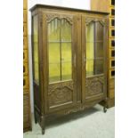 FRENCH PROVINCIAL STYLE DISPLAY CABINET, oak with carved detail, glass shelves,