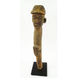 TRIBAL ARTS, a Lobi carved wooden altar post, 56cm H with modern display stand.