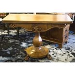 TEA TABLE, mid Victorian faded mahogany with foldover top on baluster pedestal,