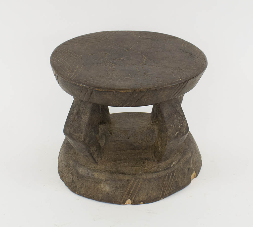 LOBI STOOL FROM GHANA, carved wood with open supports, 17.5cm H x 21cm diam.