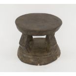 LOBI STOOL FROM GHANA, carved wood with open supports, 17.5cm H x 21cm diam.