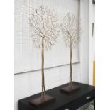 ORNAMENTAL TREES, a pair, in gilded metal on stand, 120cm H.