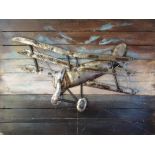 21ST CENTURY DECORATIVE WOODEN PANEL, of a triplane in metal, 75cm x 100cm.