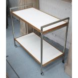 SIDE TABLE, 1970s two tier white laminated and teak with castors, 84cm W x 46cm D x 77cm H.