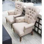 ARMCHAIRS, a pair, in neutral fabric button back on turned castor supports, 66cm W.