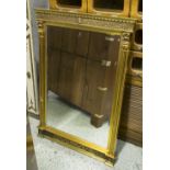 PIER GLASS, with a gilt frame and bevelled plate, 63cm W x 97cm H.
