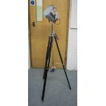 STUDIO LAMP, in chromed metal on extendable tripod supports, 160cm H.
