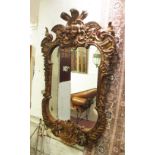 WALL MIRROR, George II style gilt with Prince of Wales type feathers and leaf,