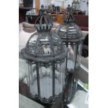 STORM CANDLE LANTERNS, a pair, Georgian style curved glass in metal frames, 65cm H x 34cm diam.