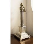 LAMPS, a pair, silvered finish, each with reeded column and stepped bases, 47cm H.