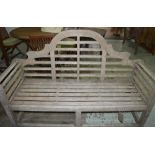 LUTYENS STYLE GARDEN BENCH, weathered teak slatted construction with scroll arms, 172cm W.