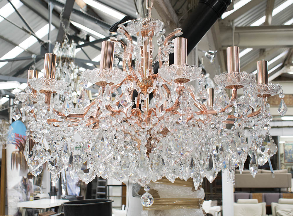 CHANDELIER, twelve branch, in coppered finish with glass drops, 50cm H plus chain.