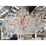 CHANDELIER, twelve branch, in coppered finish with glass drops, 50cm H plus chain.