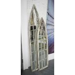 GARDEN MIRRORS, two graduated pairs, Gothic style in a distressed painted frames,