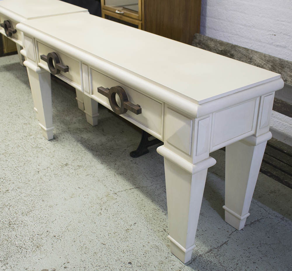 CONSOLE TABLE, of substantial proportions, cream with two drawers and feature handles,