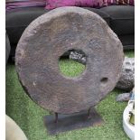 STONE CARTWHEEL, antique effect on metal stand, 54cm H.