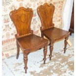 HALL CHAIRS, a pair, Victorian mahogany with panel back and seat stamped underneath 'I Turnell'.