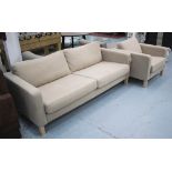 SOFA, two seater, in a beige fabric on square supports 206cm L plus a matching armchair, 91cm W.