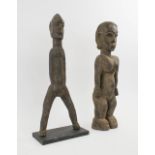 LOBI FIGURAL CARVINGS, two various, carved wood, 51cm H and 52cm H.