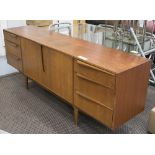 MACKINTOSH SIDEBOARD, with six drawers with cupboards below in teak 200cm x 46cm x 76cm H.